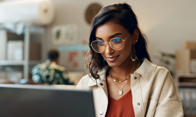 Woman reading on laptop