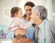 Grandmother, mother and baby in home playing