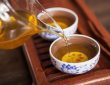 Cropped shot of pouring tea in traditional chinese teaware.