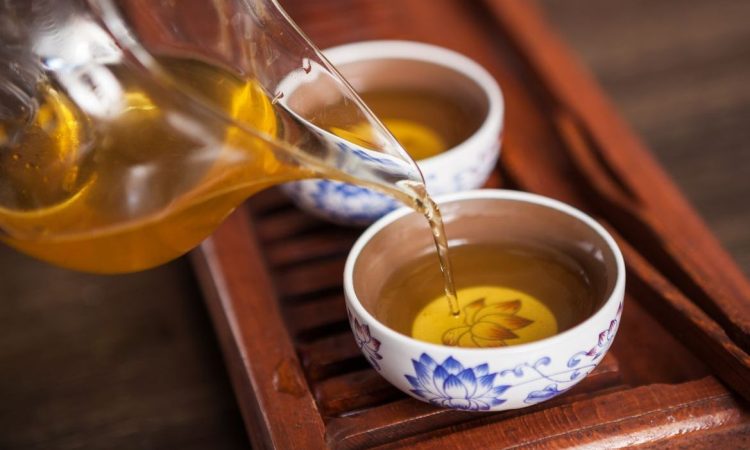 Cropped shot of pouring tea in traditional chinese teaware.