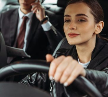 Taxi driver with passenger in back