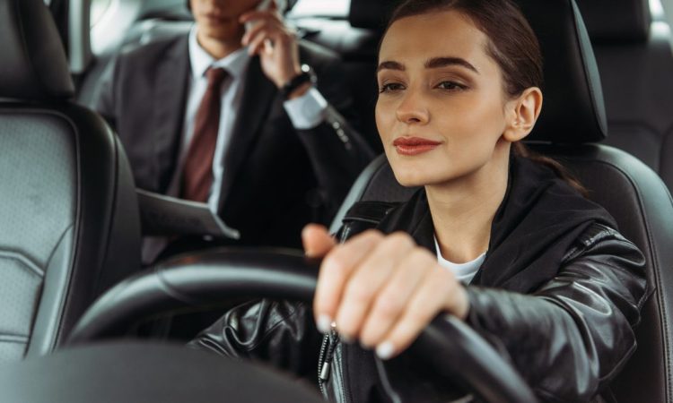 Taxi driver with passenger in back