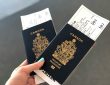 Person holding passports in hand