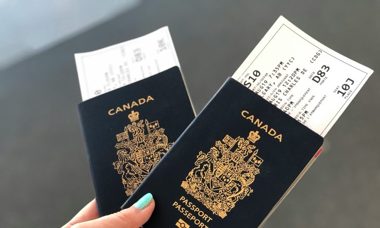Person holding passports in hand