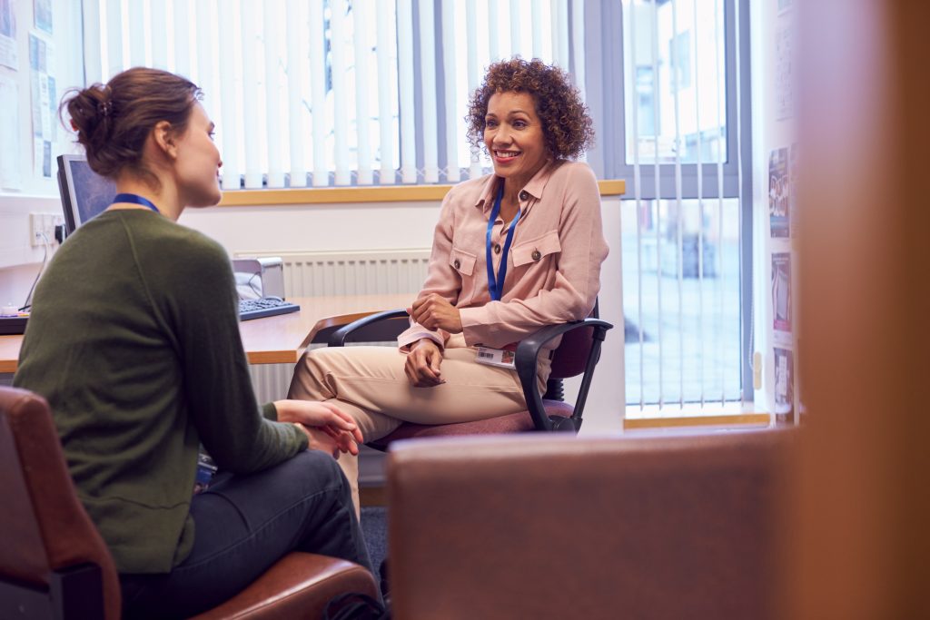 Two women talking in office