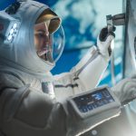 Astronaut in suit working on space station
