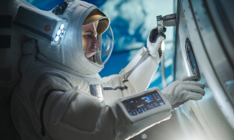 Astronaut in suit working on space station