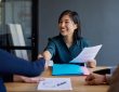 Candidate shakes hand with interviewer during job interview
