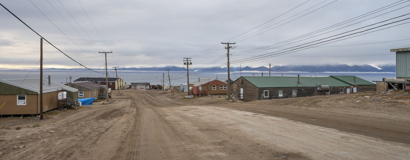 Streetscape of houses overlooking the Arctic Ocean at Pond Inlet (Mittimatalik), Nunavut