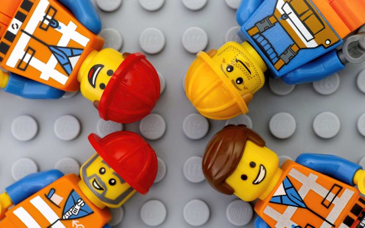 Four Lego workers minifigures