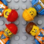 Four Lego workers minifigures