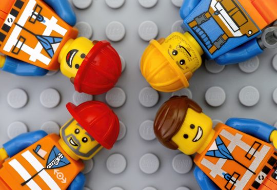 Four Lego workers minifigures