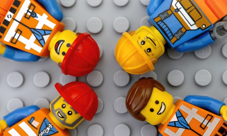 Four Lego workers minifigures