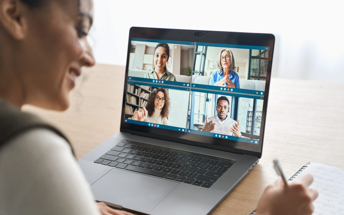 African American female student having video call videoconference on laptop. stock photo