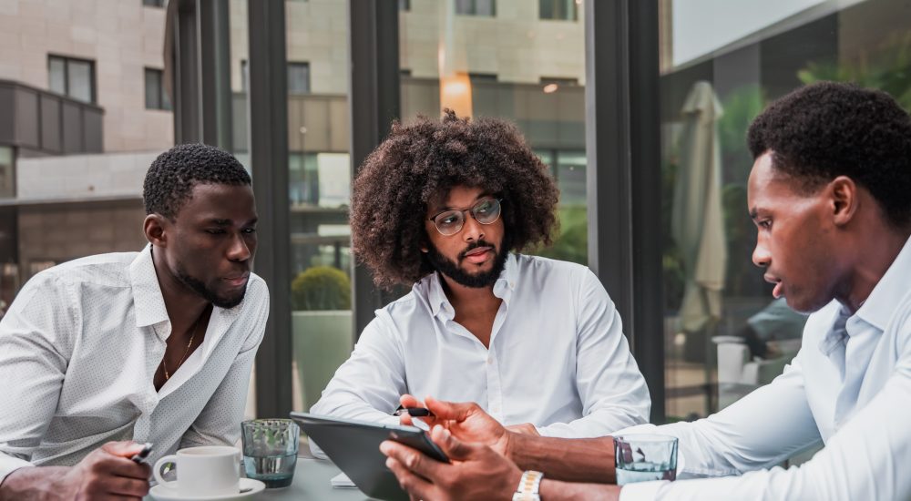 Multiracial business people working outdoor using digital tablet