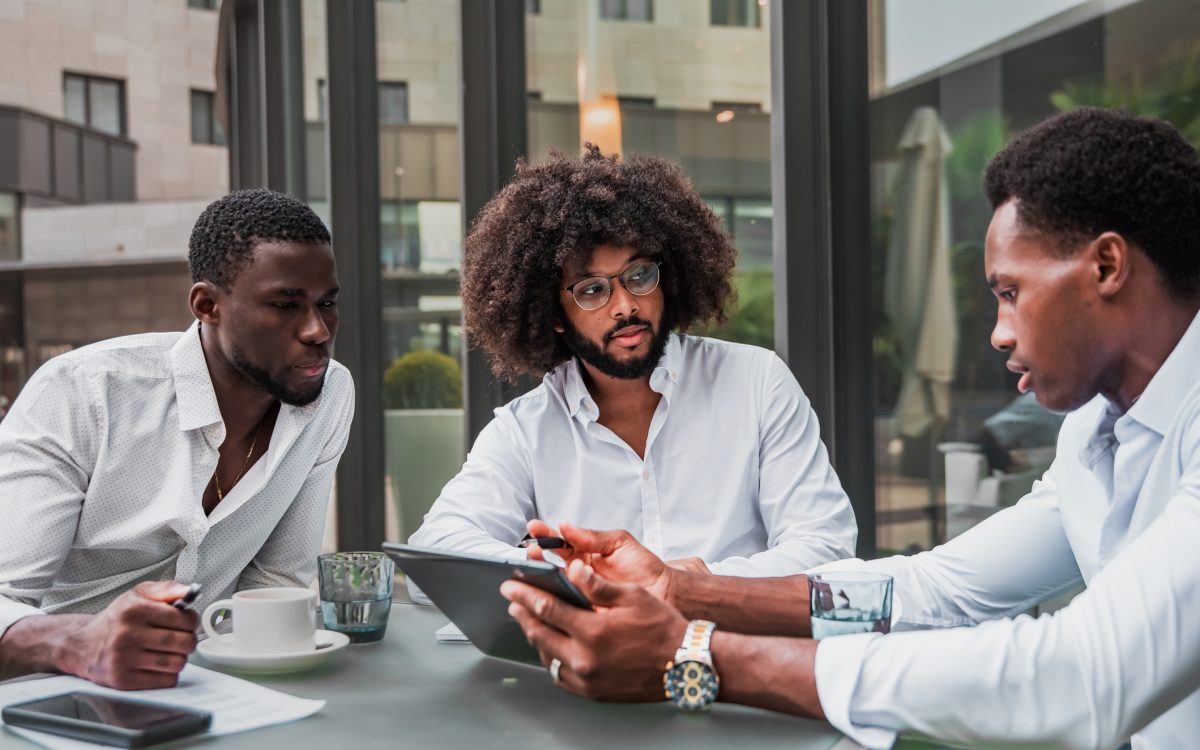 Multiracial business people working outdoor using digital tablet