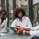 Multiracial business people working outdoor using digital tablet