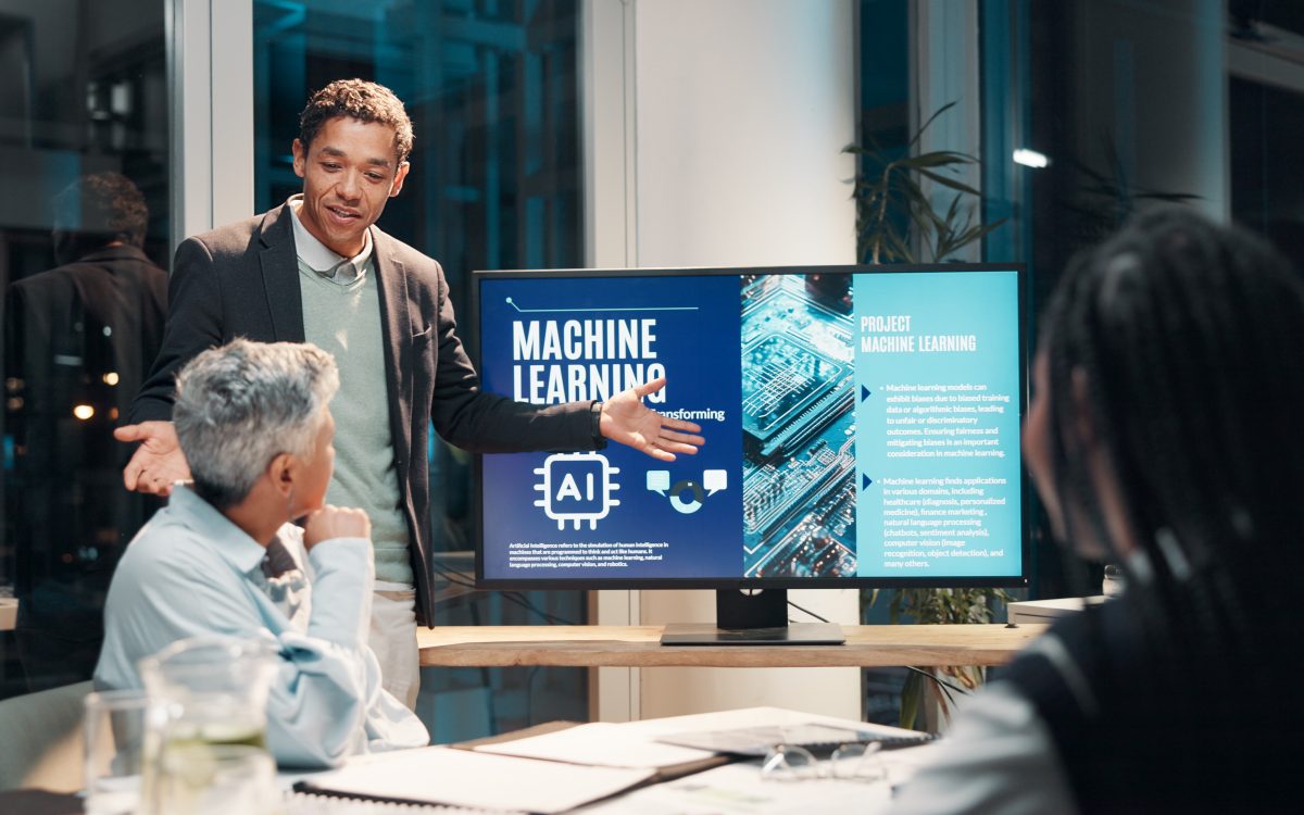 Businessman, screen and presentation in meeting for ai, machine learning or training in workshop office. Monitor, talk and team speaker with future technology for project development or idea at night