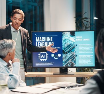 Businessman, screen and presentation in meeting for ai, machine learning or training in workshop office. Monitor, talk and team speaker with future technology for project development or idea at night