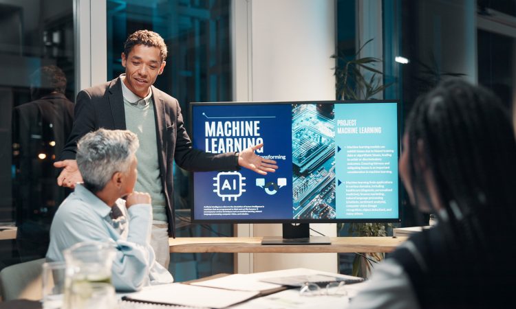 Businessman, screen and presentation in meeting for ai, machine learning or training in workshop office. Monitor, talk and team speaker with future technology for project development or idea at night