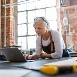 Confident senior woman working in workshop
