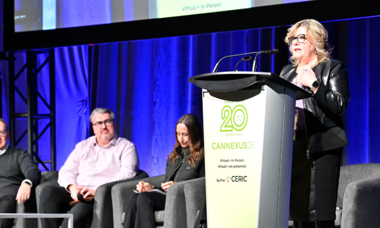 Dr. Tannis Goddard delivering a main stage speech at Cannexus26