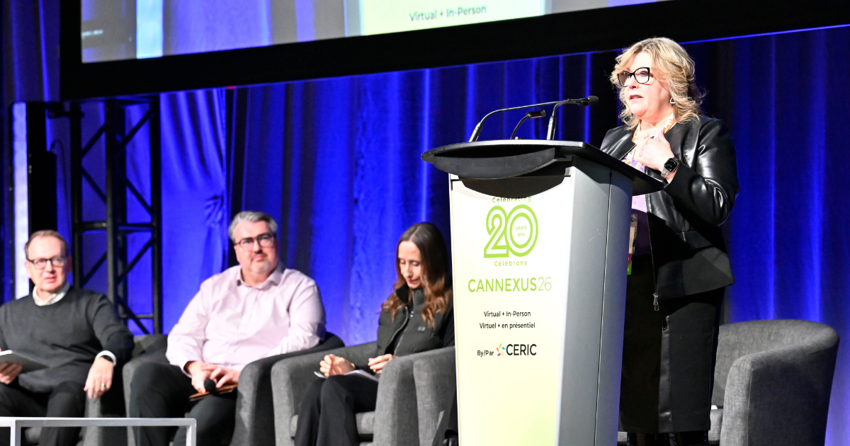 Dr. Tannis Goddard delivering a main stage speech at Cannexus26