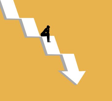 businessman sat stressed on the crisis arrow