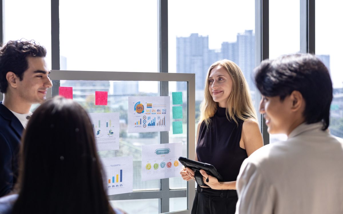 Team of caucasian entrepreneur are having a team meeting for project for marketing and sale management with skyscraper view for business startup and education
