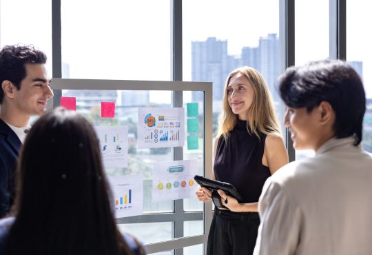Team of caucasian entrepreneur are having a team meeting for project for marketing and sale management with skyscraper view for business startup and education
