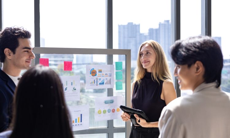Team of caucasian entrepreneur are having a team meeting for project for marketing and sale management with skyscraper view for business startup and education